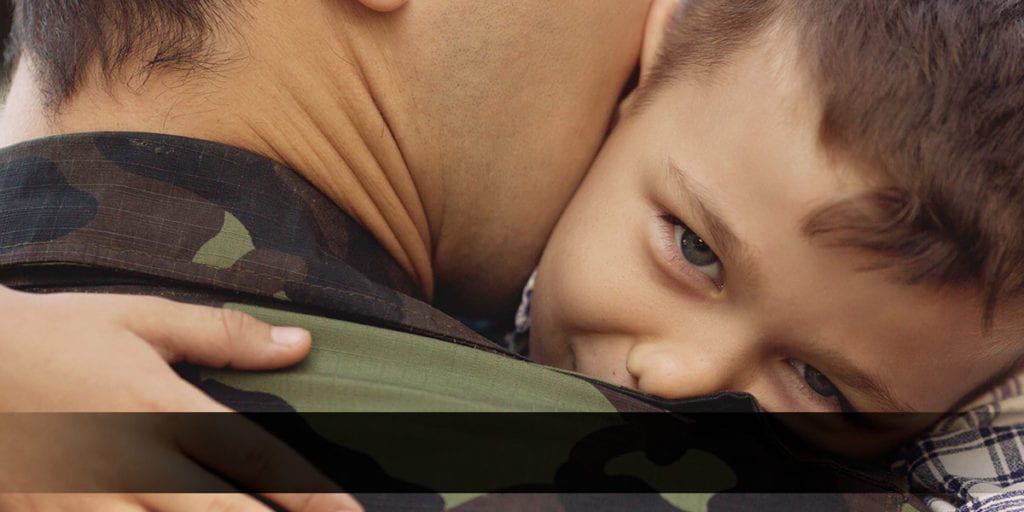 Soldier hugging his son