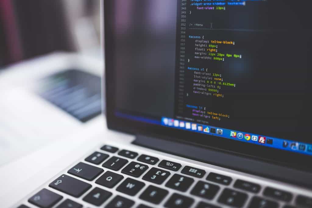 Laptop screen showing HTML code
